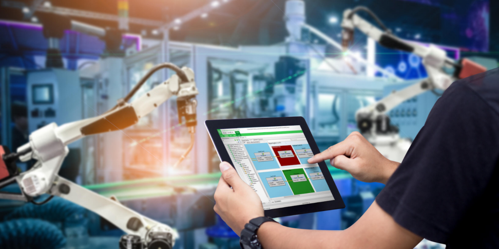 A user operating Schneider Electric's EcoStruxure platform via a tablet interface, enabling real-time monitoring and control of industrial automation systems in a smart building environment through an advanced Human-Machine Interface.